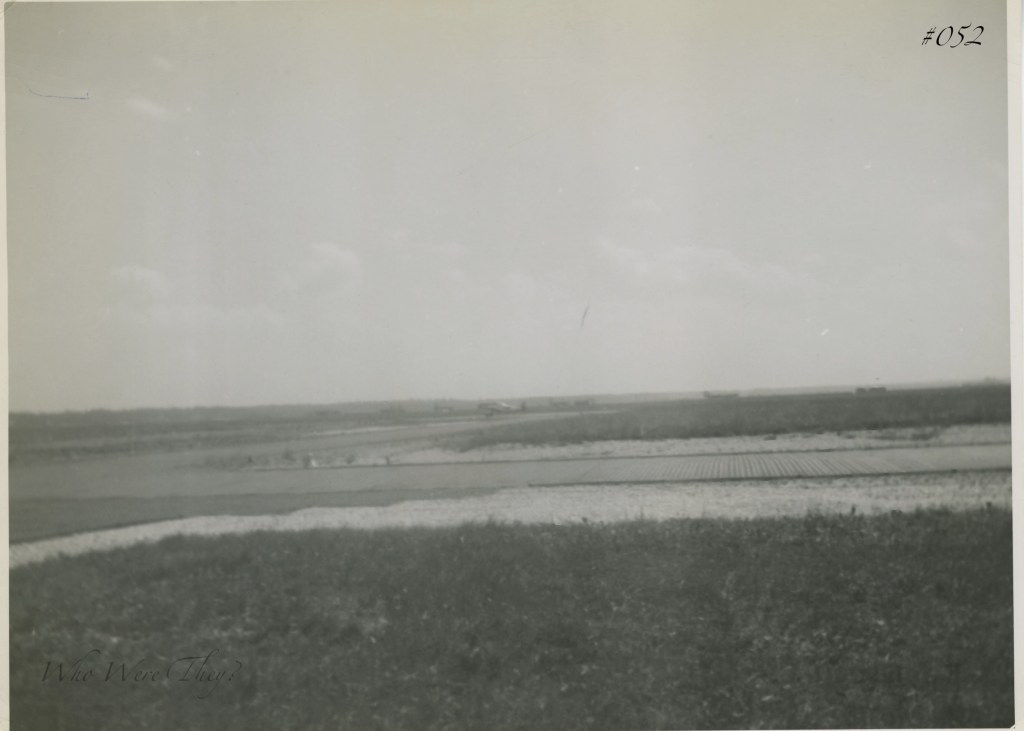 An airstrip, small plane in the distance